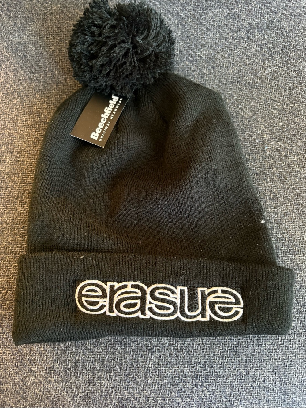 “ERASURE” Black Pom Pom Beanie